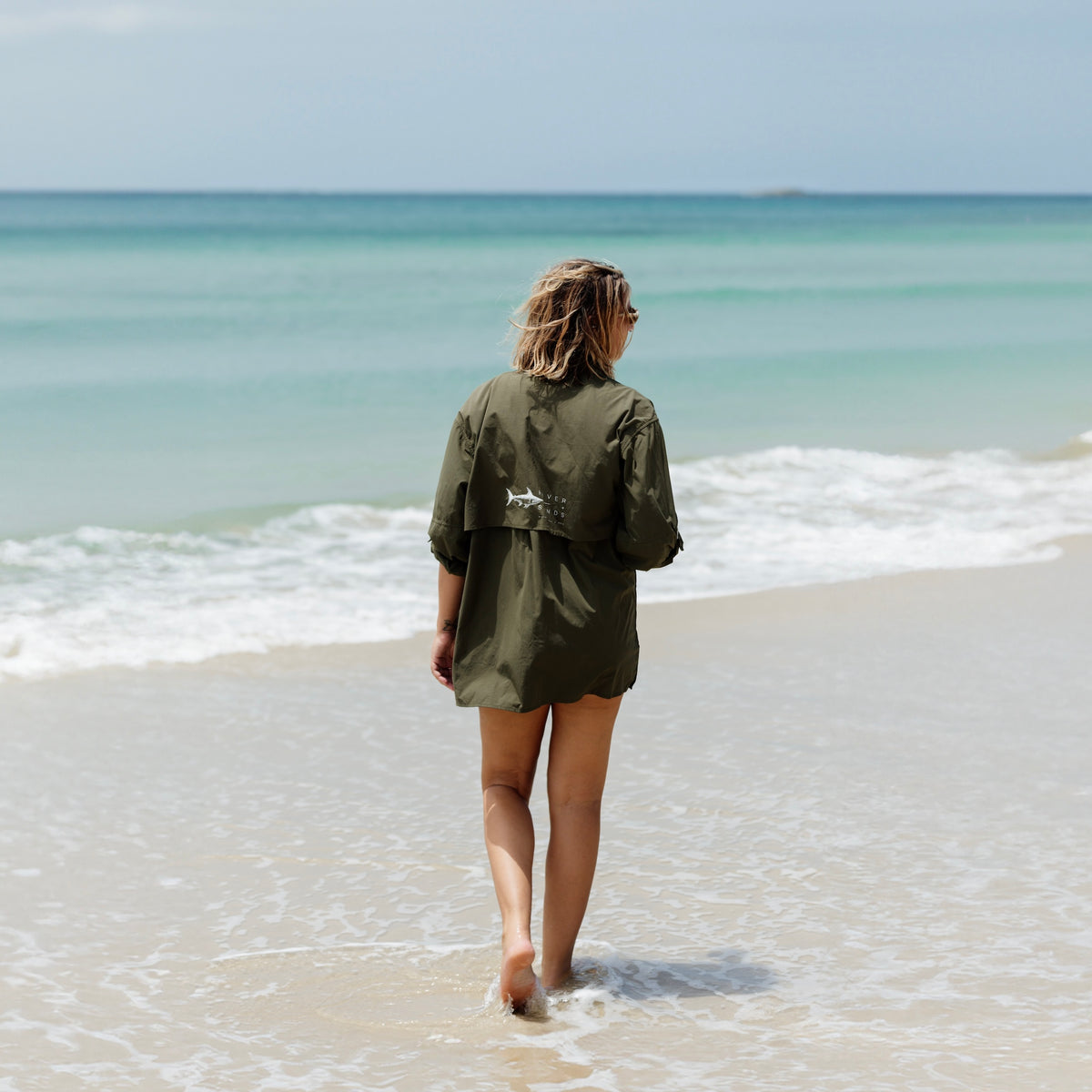 Woman on beach wearing Fishing Shirt