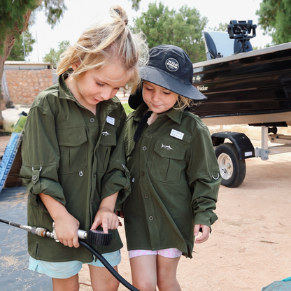 Two children wearing sun protective upf fishing outdoor shirts
