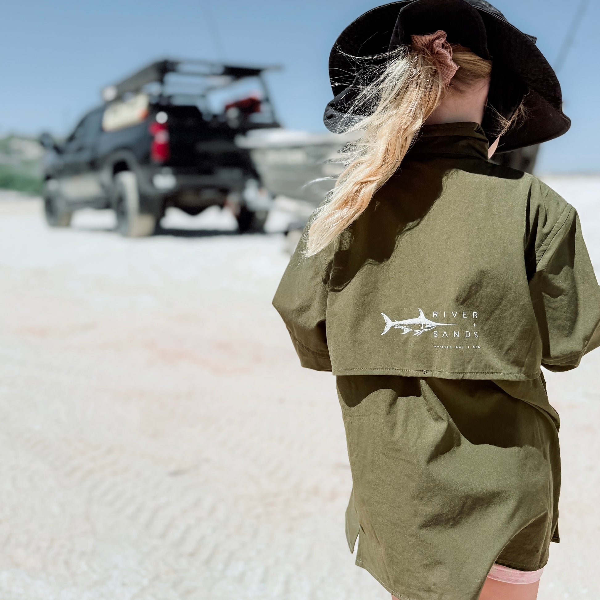 child wearing sun protective outdoor fishing shirt